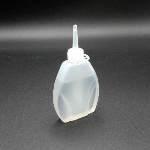 Aceite para máquina de coser con dosificador